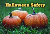 Halloween Safety text. Three pumpkins sitting in the grass.